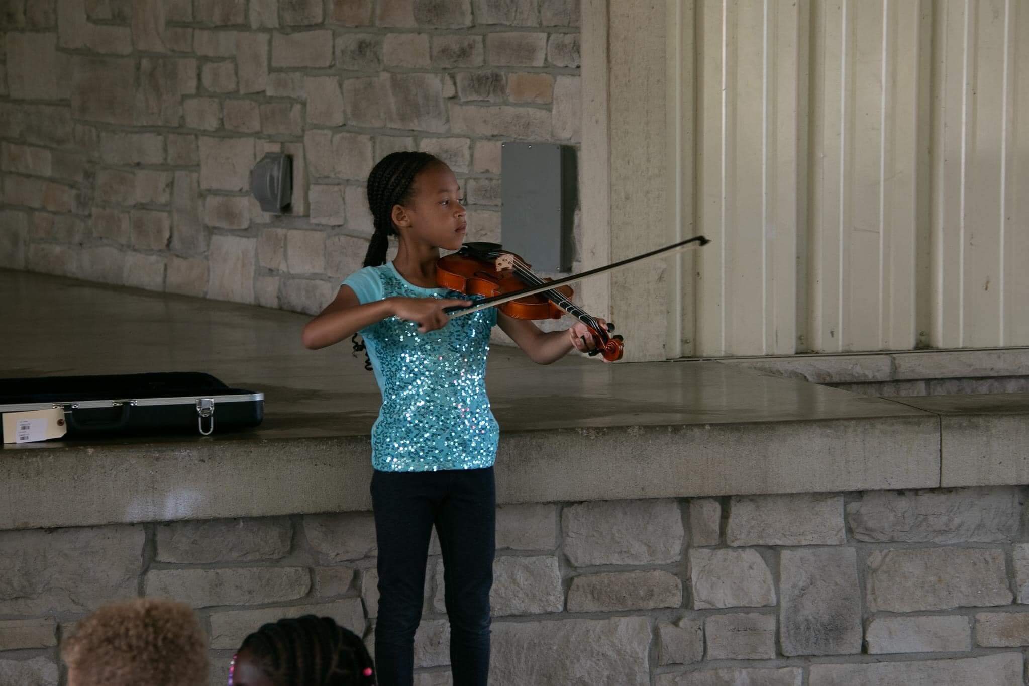 Kids playing a violin at Valpo Creates Camp 2023